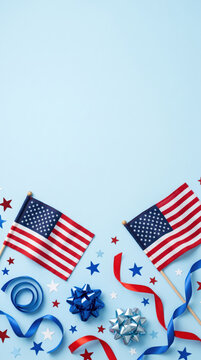 Creative USA themed flat lay with miniature American flags and red white blue decorations along bottom edge, festive patriotic background with ample copy space for Independence Day