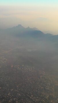Ulhas river, Mumbai, India. Badlapur is a city in Thane district, Maharashtra state, India, and is a part of Mumbai Metropolitan Region. Aerial View From Airplane Window On View of the Mumbai suburb