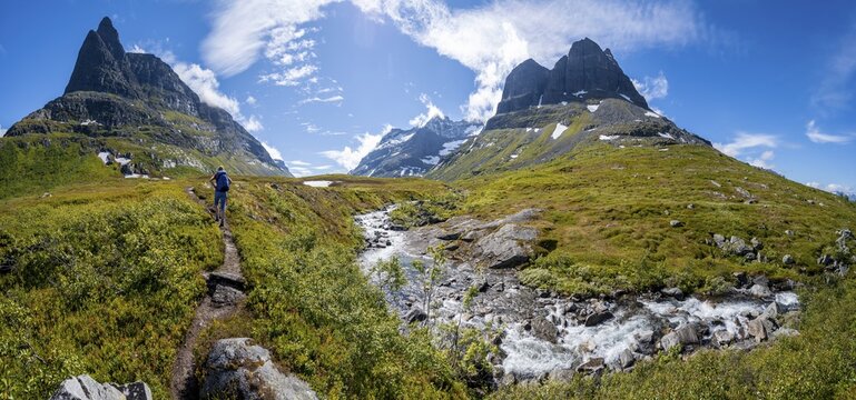 Hiker on a hiking trail to Innerdalst&aring;rnet, Innerdalen high valley, mountains, Trollheimen Mountain Area, Sunndal, M&oslash;re og Romsda, Vestlandet, Norway