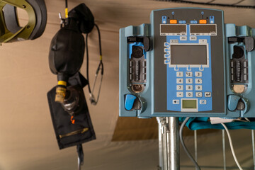 Obraz premium Infusion Pump on field hospital ready for war zone healthcare support