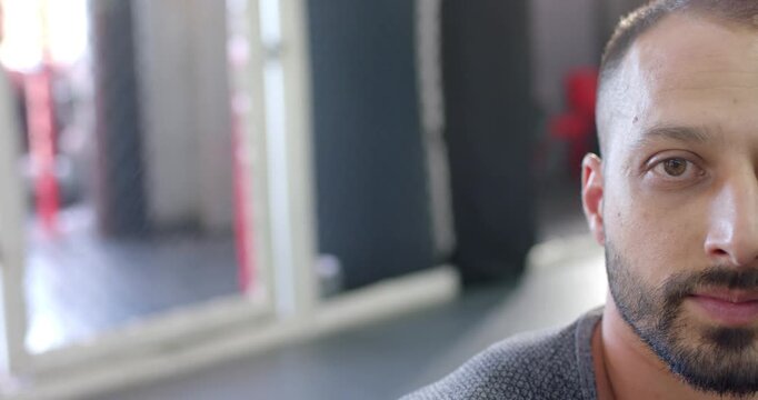 man holding steady gaze into camera