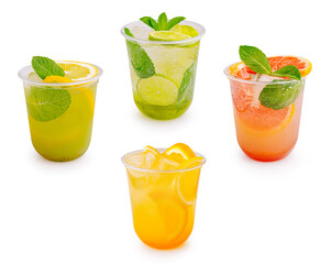 Four different cold citrus lemonade drinks stand on white background. Refreshing summer mocktails are decorated with fresh lime, orange, grapefruit slices and mint. © AntAlexStudio