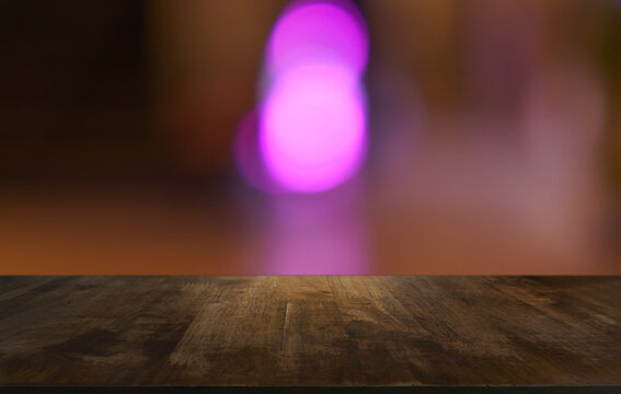 Empty wood table top and blur of restaurant background selective focus product display