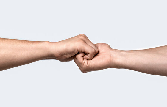 Male hand united in handshake. Man help hands, guardianship, protection. Friendly handshake, friends greeting. Man and woman hand united in handshake. That could mean help, guardianship, protection