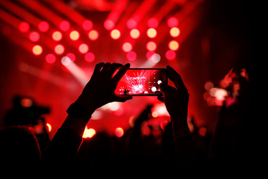 Holding Smartphone To Record Live Music Concert