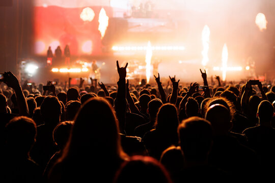 Music Crowd Cheering with Horns Sign at Pyrotechnics Show
