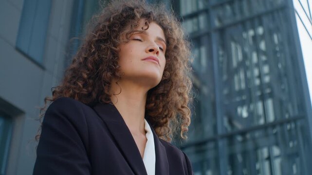 Close up calm peaceful relaxed pensive Caucasian business woman thinking enjoying work break in city businesswoman girl female executive think contemplate enjoying working pause at office balcony