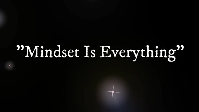 Motivational Mindset Is Everything Quote on Dark Background with Glowing Lens Flare
