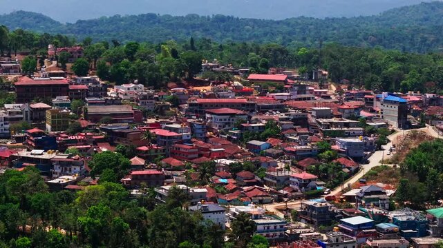 Countryside houses with trees, hills and road at suntikoppa, Madikeri, coorg, karnataka, india. day time, semi circle shot, drone shot, 4k.