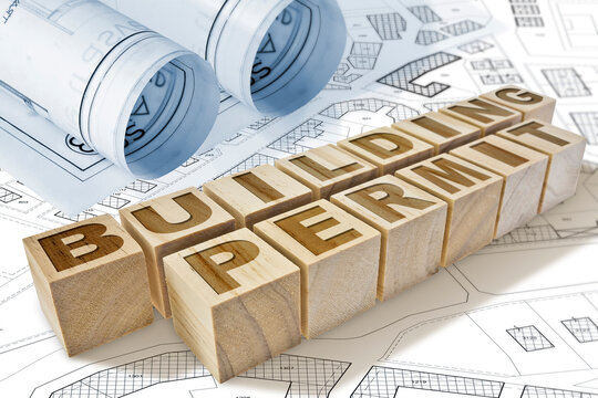 BUILDING PERMIT CONCEPT IN BUILDINGS ACTIVITY AND CONSTRUCTION INDUSTRY with text written on wooden cubes, residential building project, imaginary cadastral map and General Urban Plan