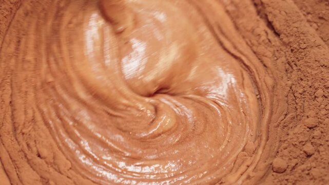 Chocolate Batter Swirling With Cocoa Powder During Mixing, Brownie Preparation And Homemade Baking Process