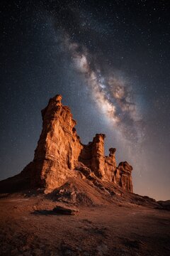 Red rock formations under a starry sky in the Atacama Desert