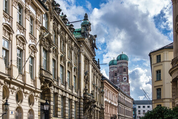 Fototapeta premium Famous Munich Cathedral, also called Cathedral of Our Dear Lady in Munich, Germany. Seen from Kardinal-Faulhaber street