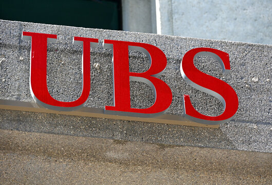 Geneva, Switzerland, Europe - 05.2026 : Three-keys logo (symbols of confidence, security, and discretion) and name of UBS bank - formely Union Bank of Switzerland, sign on facade of UBS branch