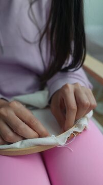 Detailed closeup of sewing process and fabric positioning