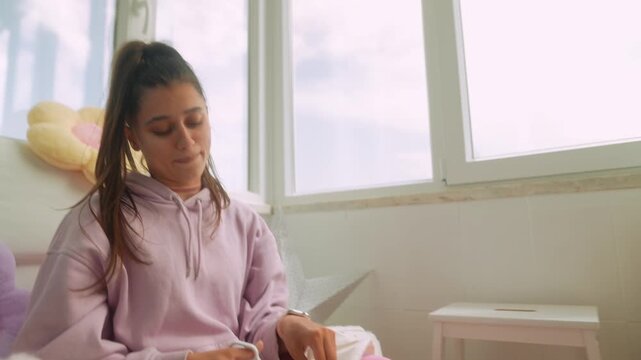 Female artist engaged in paper craft within relaxing ambiance