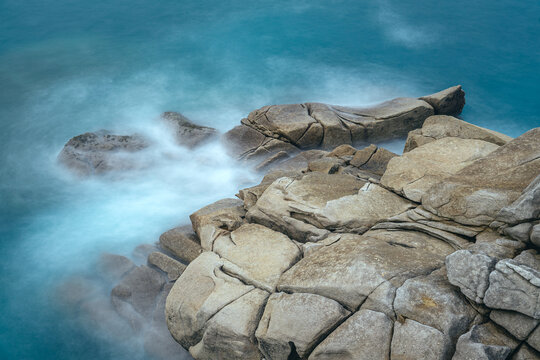 Granite rock formations in the Cliffs of Paper in San Ciprian, Lugo, Galicia, Spain.