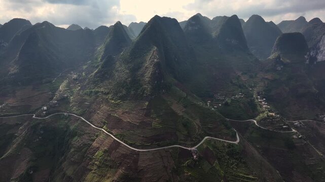 The winding road of Ma Pi Leng Pass in Vietnam. A Part of a Famous Ha Giang Loop. Beautiful destinations Asia. Aerial.