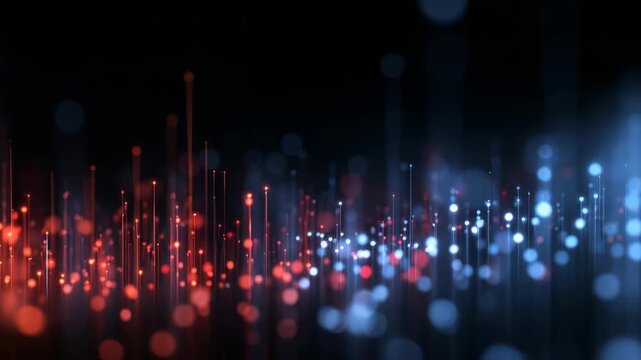 A mesmerizing array of illuminated vertical lines and sparkling dots forms a modern, high tech scene. This abstract image evokes concepts of data, connectivity, and digital transformation