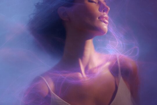Breathwork woman exhaling spirals of shimmering light and purple glow for meditation background and wellness poster banner design
