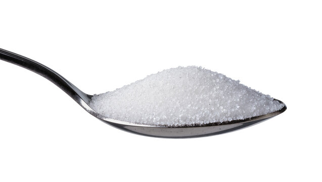 Isolated full tablespoon of white refined granulated sugar for sweet food and drinks.