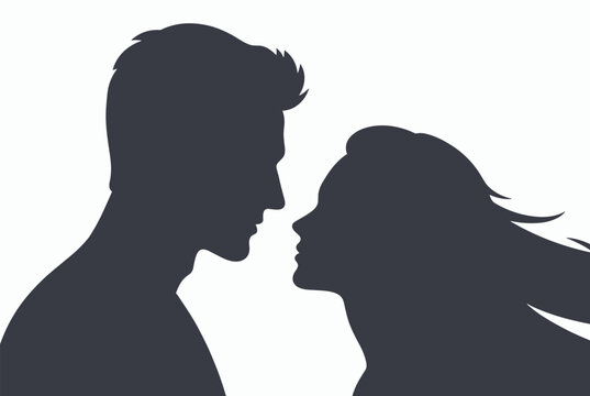 Dark silhouette of a man and woman facing each other in a profile view representing romance love and interpersonal connection.