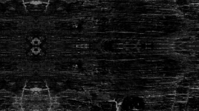 Dark abstract texture with mirrored symmetry, scratches, noise, and eerie monochrome atmospheric appearance throughout.