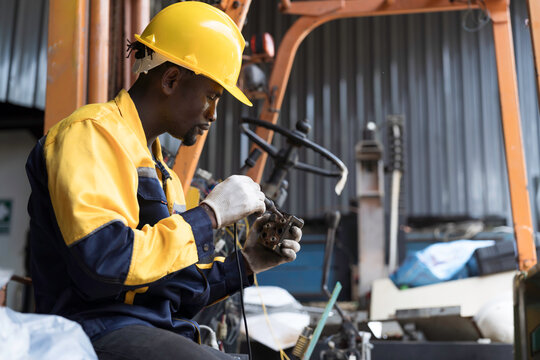 Automotive electrician or auto electrician checking, repair, maintenance operation automotive electrical systems