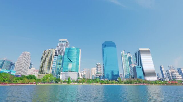 Beautiful daytime cityscape of a futuristic financial district looking over the water in Bangkok, Thailand