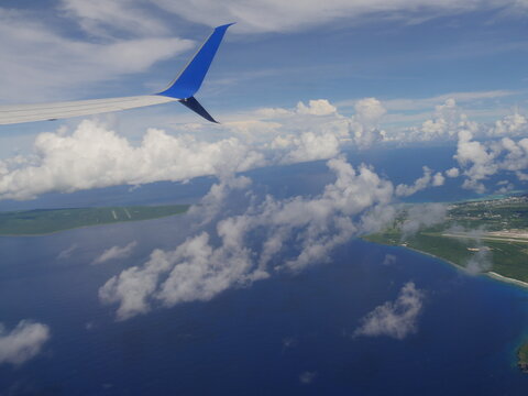 Aerial shot of Saipan and Tinian islands divided by the Saipan-Tinian channel, Northern Mariana Islands.