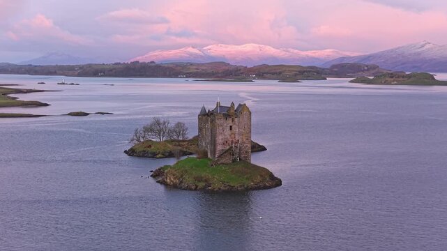 Castle stalker on an islet during a stunning sunrise