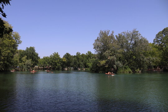 Tourists rowing boats on a sunny day at Albufera de Anna lake, Spain