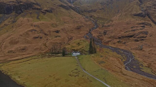 Dramatic aerial view of glen coe with loch achtriochtan and a cottage