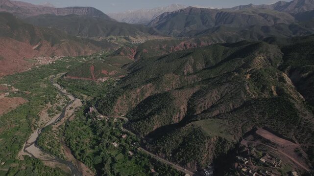 Ourika Valley near Setti Fatma, Al Haouz Marrakesh Safi, Morocco, featuring the Ourika River valley, mountain road corridor and traditional Berber settlements beneath High Atlas Mountain, aerial