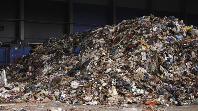 Garbage Recycling Factory, Plastic cubes for recycle Plant, Bales of pressed boxes, rubbish warehouse collection. Preparation of recyclables for recycling, Plastic city garbage.