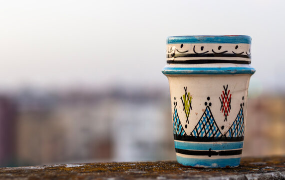 Traditional Handmade Moroccan Ceramic Tea Cup on a Rooftop in Meknes