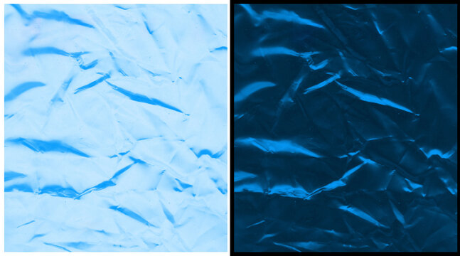 Crumpled blue paper texture background, wrinkled metallic foil surface, abstract creased material in light and dark blue tones for creative design