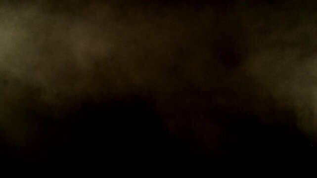 Super Slow Motion Shot of Flying Sand Powder , Isolated on Black Background , Filmed on High Speed Cinematic Camera at 1000 FPS