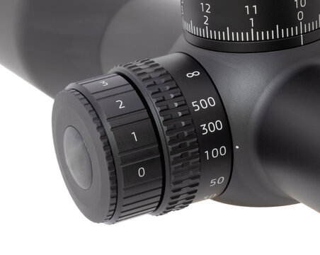 Parallax and reticle brightness adjustment dials on a riflescope