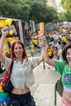 People celebrating lgbtq plus pride in a street parade