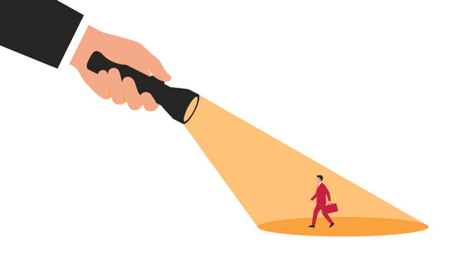 Big hand holding flashlight shining yellow light on small businessman in suit with briefcase, Represents talent scouting recruitment and symbolizes professional career search discovery
