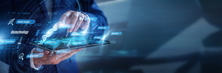 Obraz premium Medical researcher working on tablet analyzing modern Biotechnology. Professional examining advanced DNA structures and genetic engineering data graphs on a futuristic glowing hologram screen.