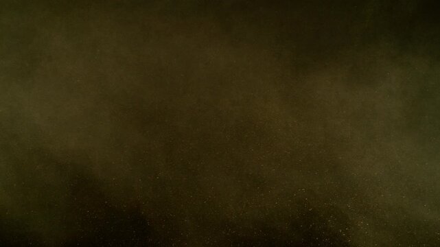 Super Slow Motion Shot of Flying Sand Powder , Isolated on Black Background , Filmed on High Speed Cinematic Camera at 1000 FPS