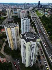 Vertical aerial drone view of the iconic Gwiazdy star-shaped residential skyscrapers and heavy highway traffic in Katowice, Poland. © DronON_PL