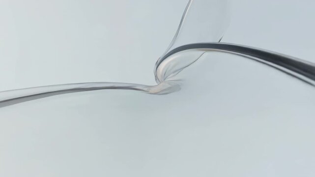 Abstract transparent fluid flowing in elegant slow motion