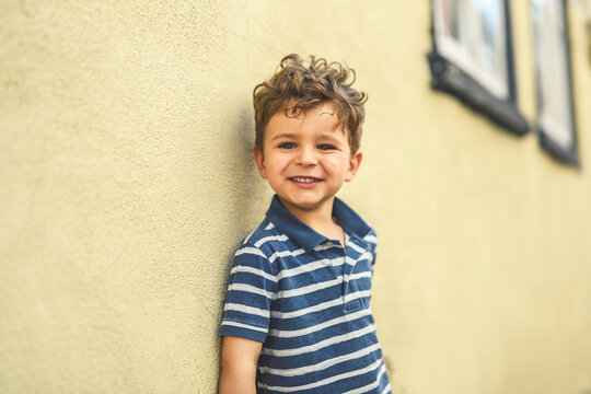 two years old child boy outside in urban summer season