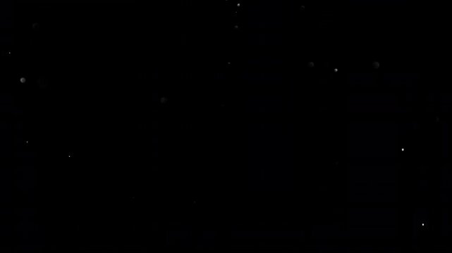 Super Slow Motion Shot of Flying Small Particles , Isolated on Black Background , Filmed on High Speed Cinematic Camera at 1000 FPS