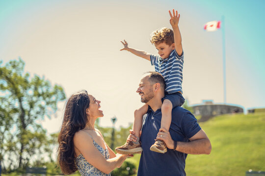 Mother father and son having great time outdoors in a park