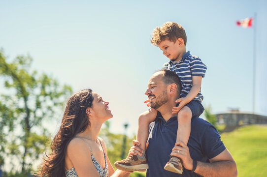 Mother father and son having great time outdoors in a park