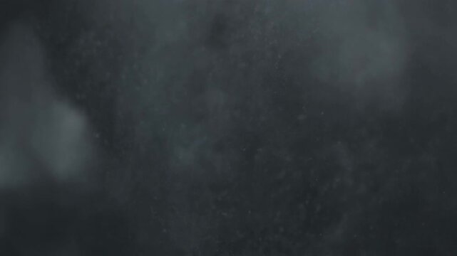 Macro Shot of Fine Dust Particles Within Monochromatic Smoke Catching Subtle Light, Cinematic Full HD Dark Abstract Background